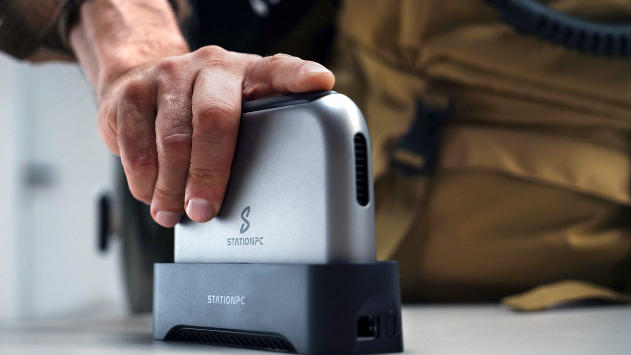 A lifestyle image of the PocketCloud being plugged into its dock