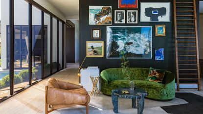 a modern living room with a gallery wall