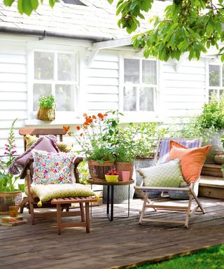 chairs on decking with colorful cushions