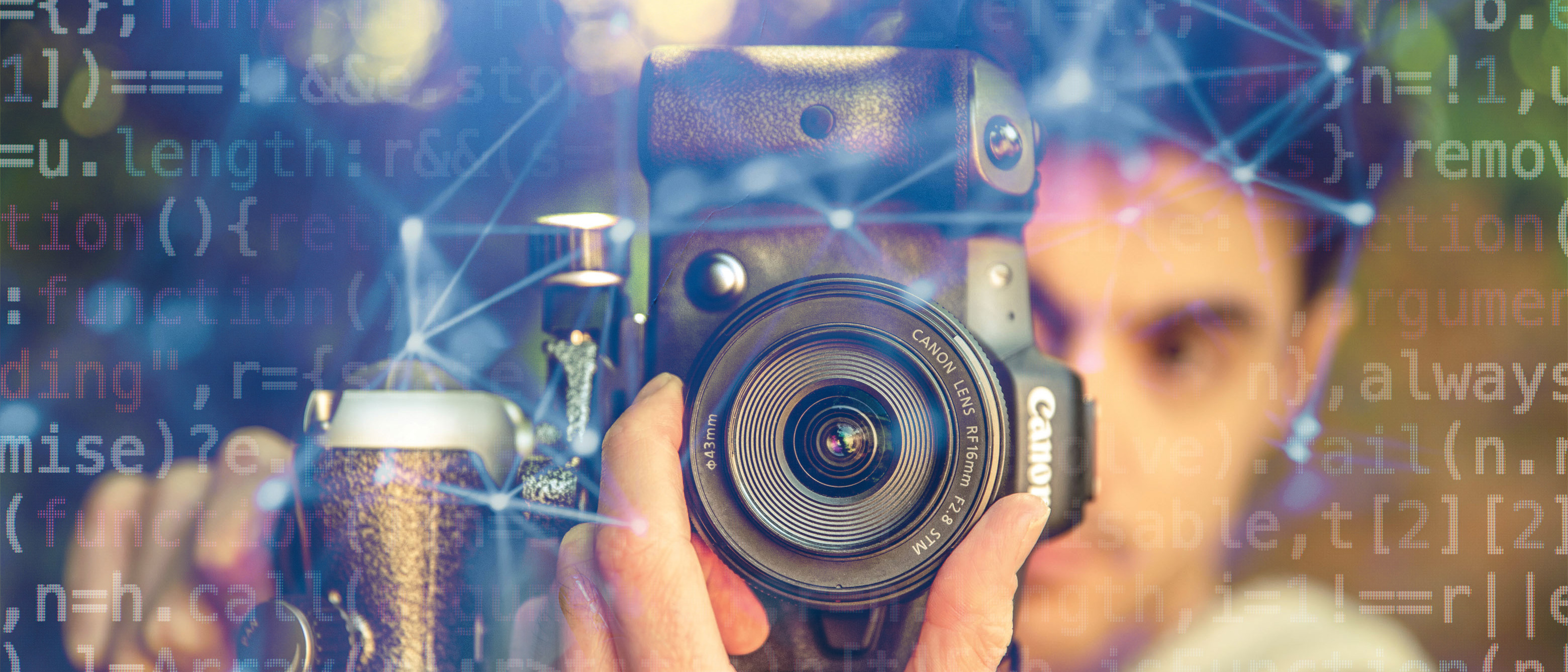 A man with a Canon EOS R5 Mark II camera, the image overlaid with computer code