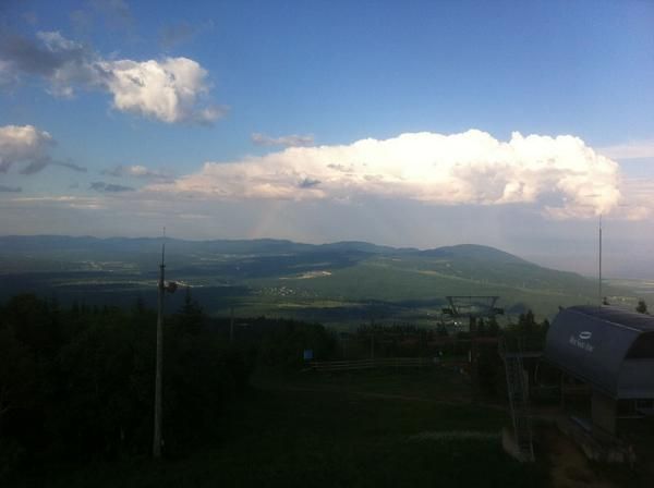 A view from atop the downhill course. Look carefully and you can see a rainbow.