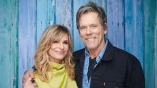 kyra sedgwick and kevin bacon on a blue background