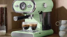 Green Silvercrest coffee maker on worktop, making 2 espressos