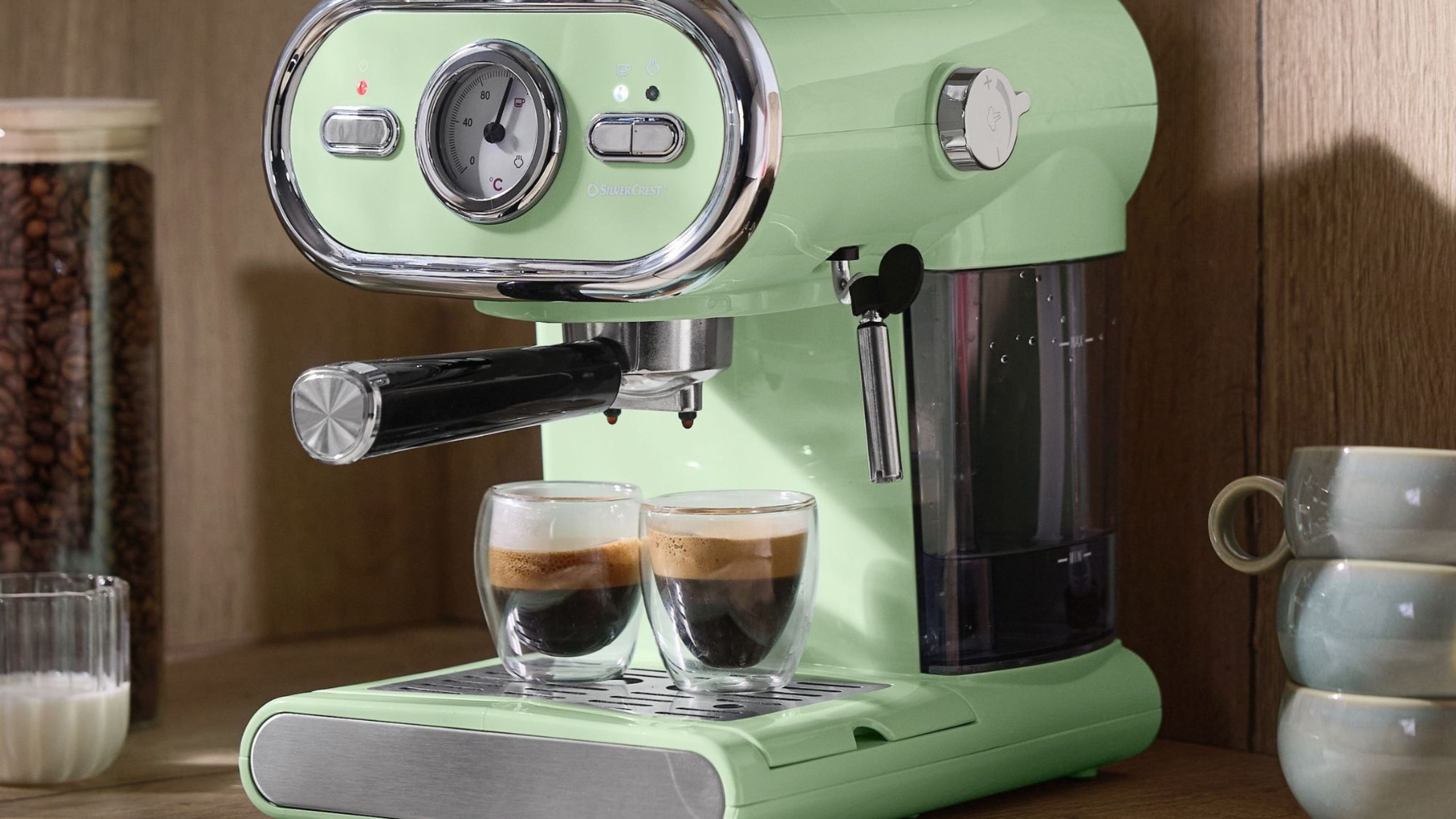 Green Silvercrest coffee maker on worktop, making 2 espressos