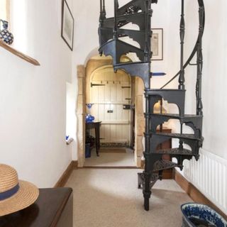 room with staircase and frame on wall