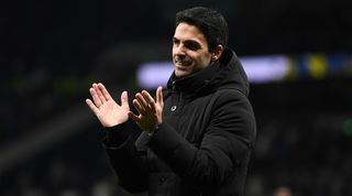 Arsenal manager Mikel Arteta applauds the fans after his side's derby win away to Tottenham in January 2023.