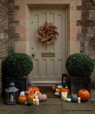 topiary and autumnal decor from Sophie Allport by front door
