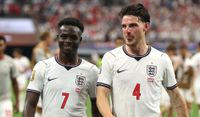 Bukayo Saka #7 and Declan Rice #4 of England react after the 4-2 win during the FIFA World Cup 2026 Group L match between England and Croatia at Dallas Stadium on June 17, 2026 in Arlington, Texas