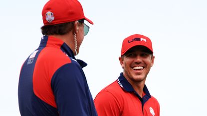 Phil Mickelson and Brooks Koepka celebrate after Team USA's 19 to 9 win over Team Europe in the 2021 Ryder Cup
