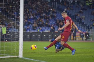 Roma’s Edin Dzeko scores his side’s third goal against Lecce (Fabio Rossi/AP)
