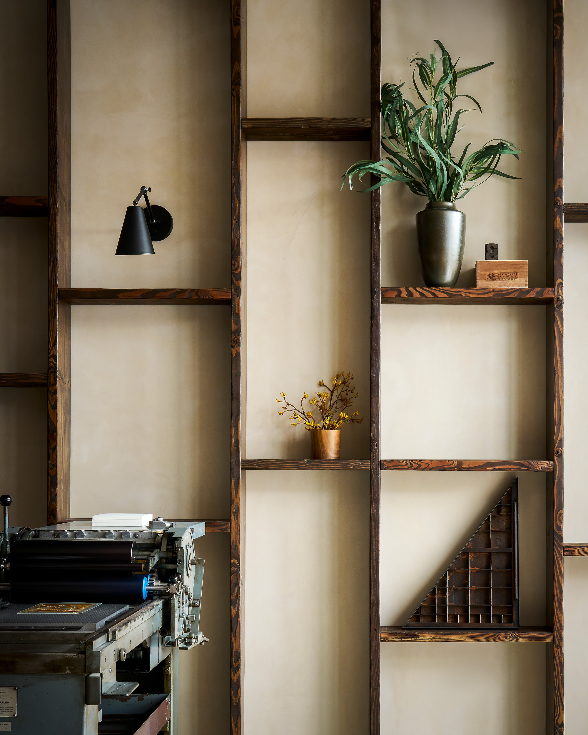 The shelves are designed to shape the space as well for display