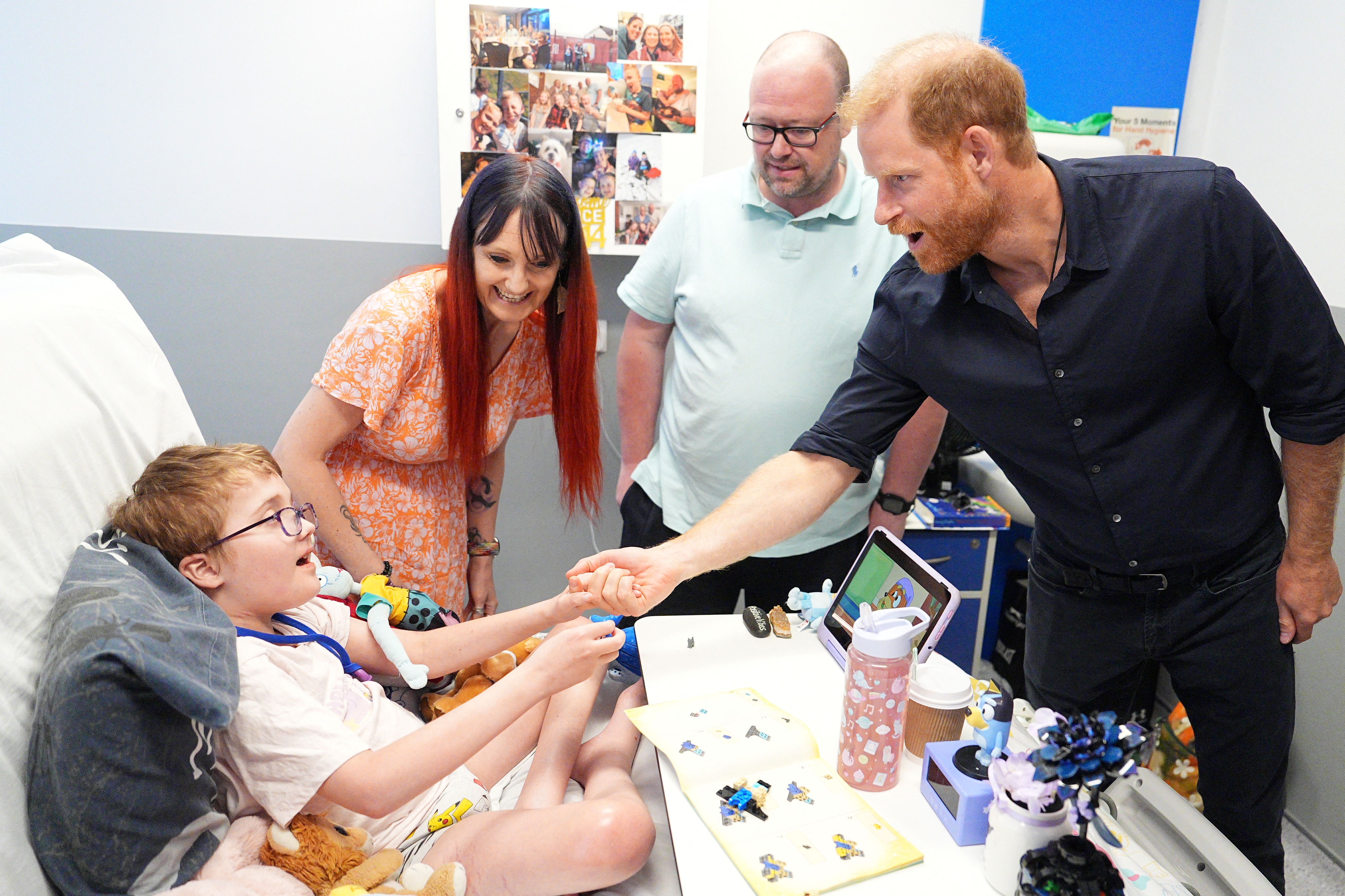 Prince Harry visits Birmingham Children's Hospital where he meets a young patient who loved Lego, just like his son Archie