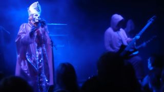 Ghost performing onstage