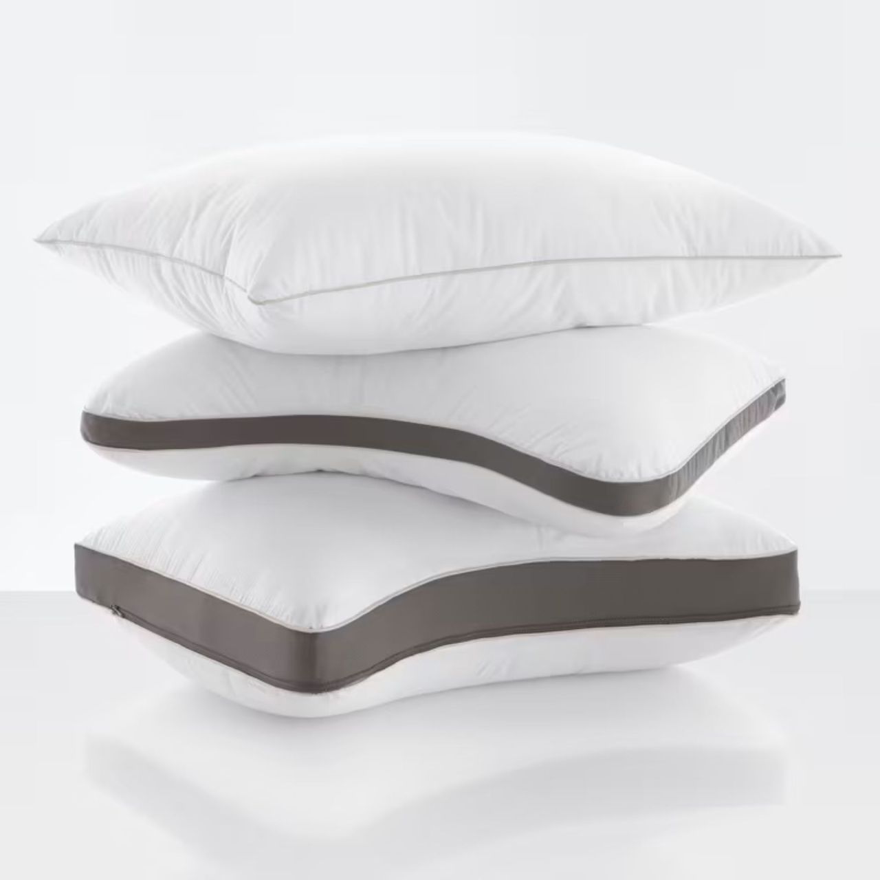Three PlushComfort Pillows stacked on top of each other.
