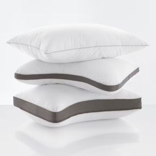 Three Plush Comfort Pillows stacked on top of each other.