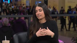 Asha Sharma in black shirt