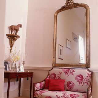 hallway with wall mirror and couch