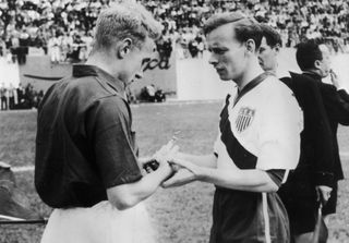 The captains of England and USA, Billy Wright and Ed McIlvenny (right) exchange souvenirs at the start of their match on June 29, 1950 in Belo Horizonte.