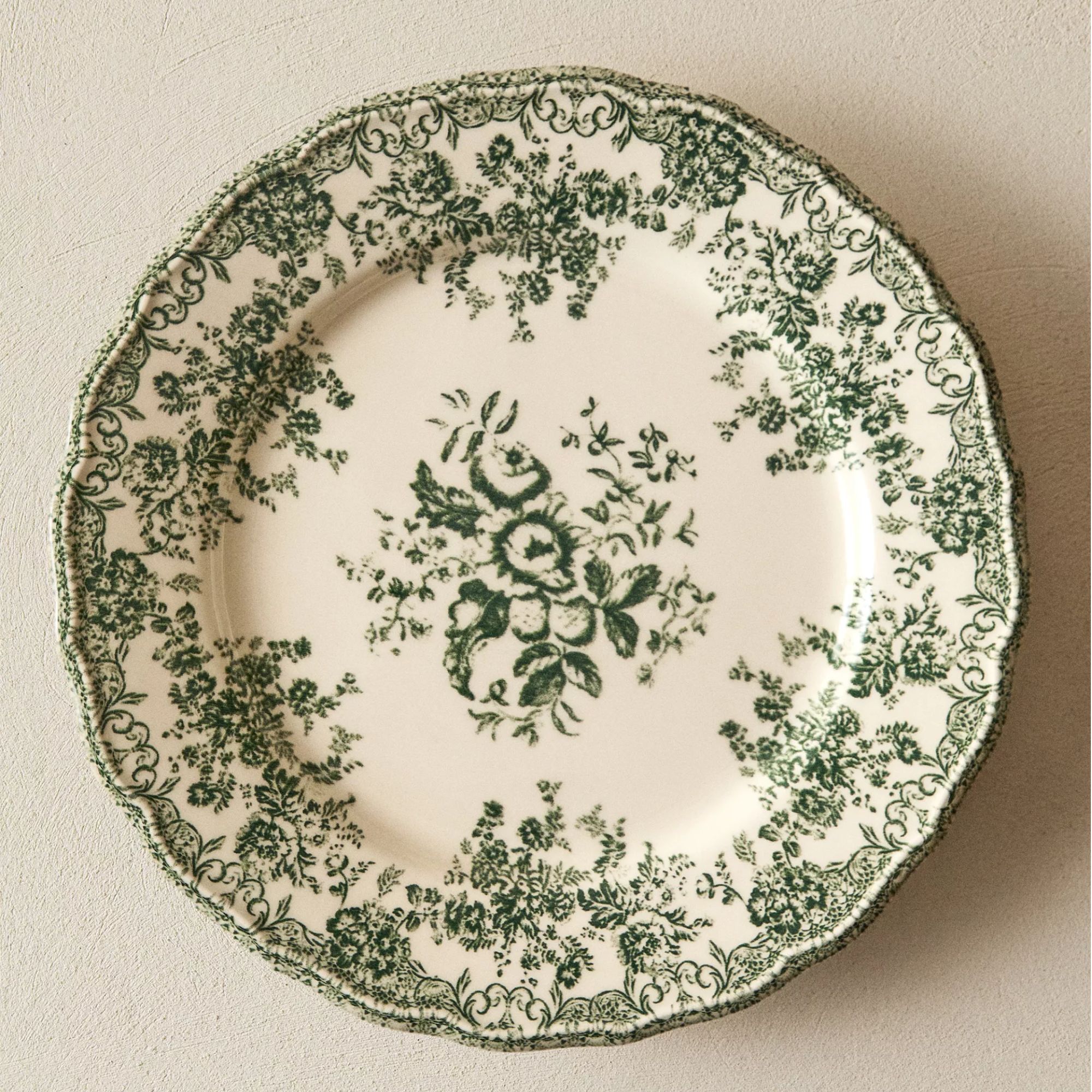 White stoneware plate with green floral design
