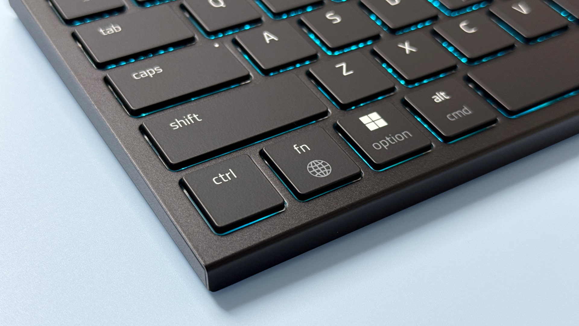 A Razer Basilisk Mobile gaming mouse and Razer Joro portable gaming keyboard on a blue background.