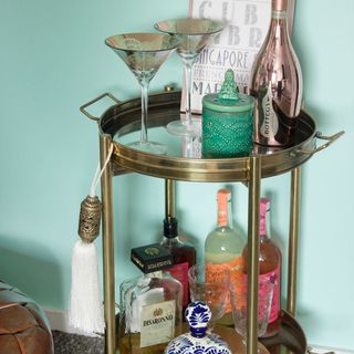 living area corner with bar trolley and bottles