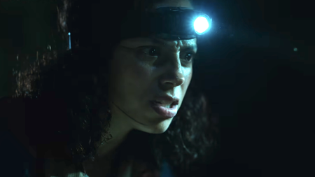 Kiana Madeira with a head flashlight on in Beware Boi&uacute;na