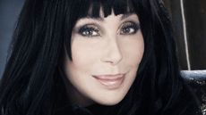 cher on a dark background