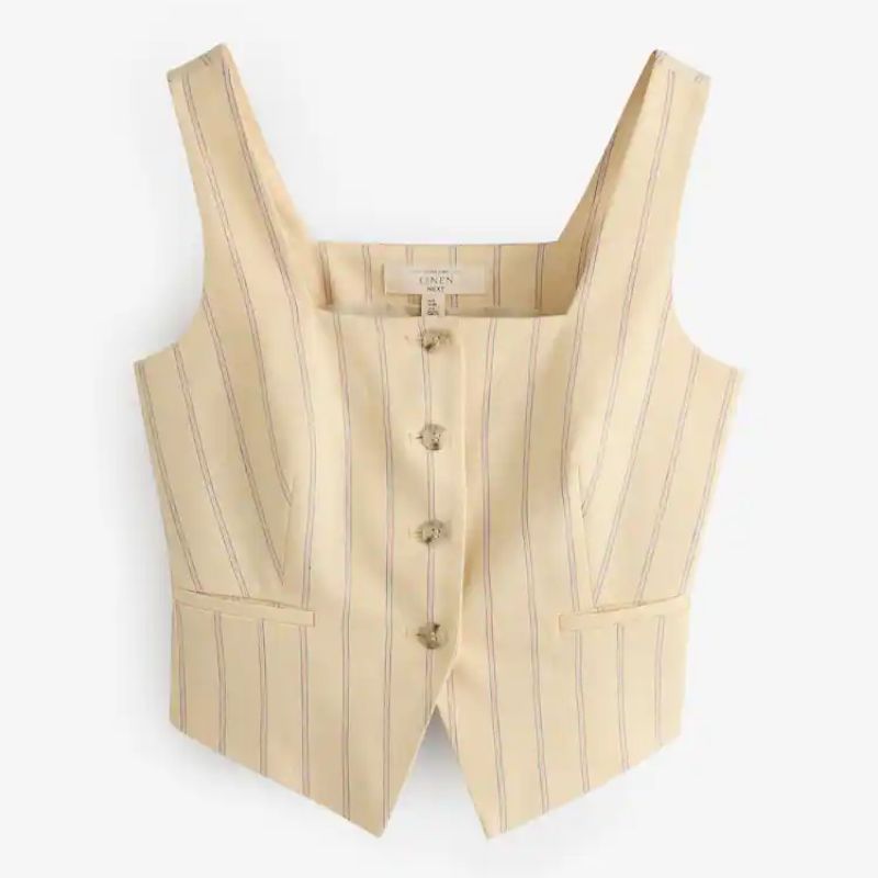 A cutout of a cream pinstripe waistcoat