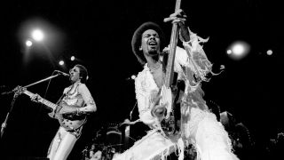 George Johnson (L) and Louis Johnson (R) from the Brothers Johnson perform live at Madison Square Garden in New York in 1976