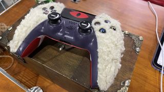 A custom made Cult of the Lamb PlayStation controller.