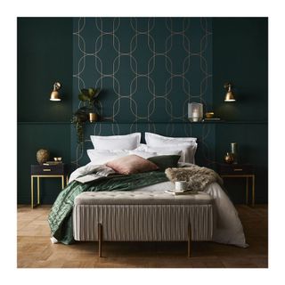 dark wallpaper with geometric copper pattern and green velvet bed