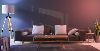 dark gray living room by night with low level lamp light and LED coloured lights to showcase how to transform a living room on a budget