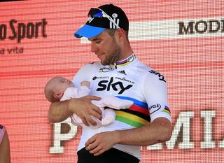 Proud father Mark Cavendish on the podium with daughter Delilah.