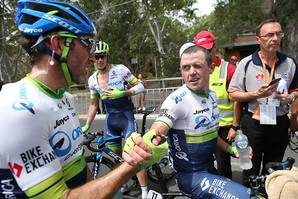 Teammates congratulate Simon Gerrans for his stage 3 win.