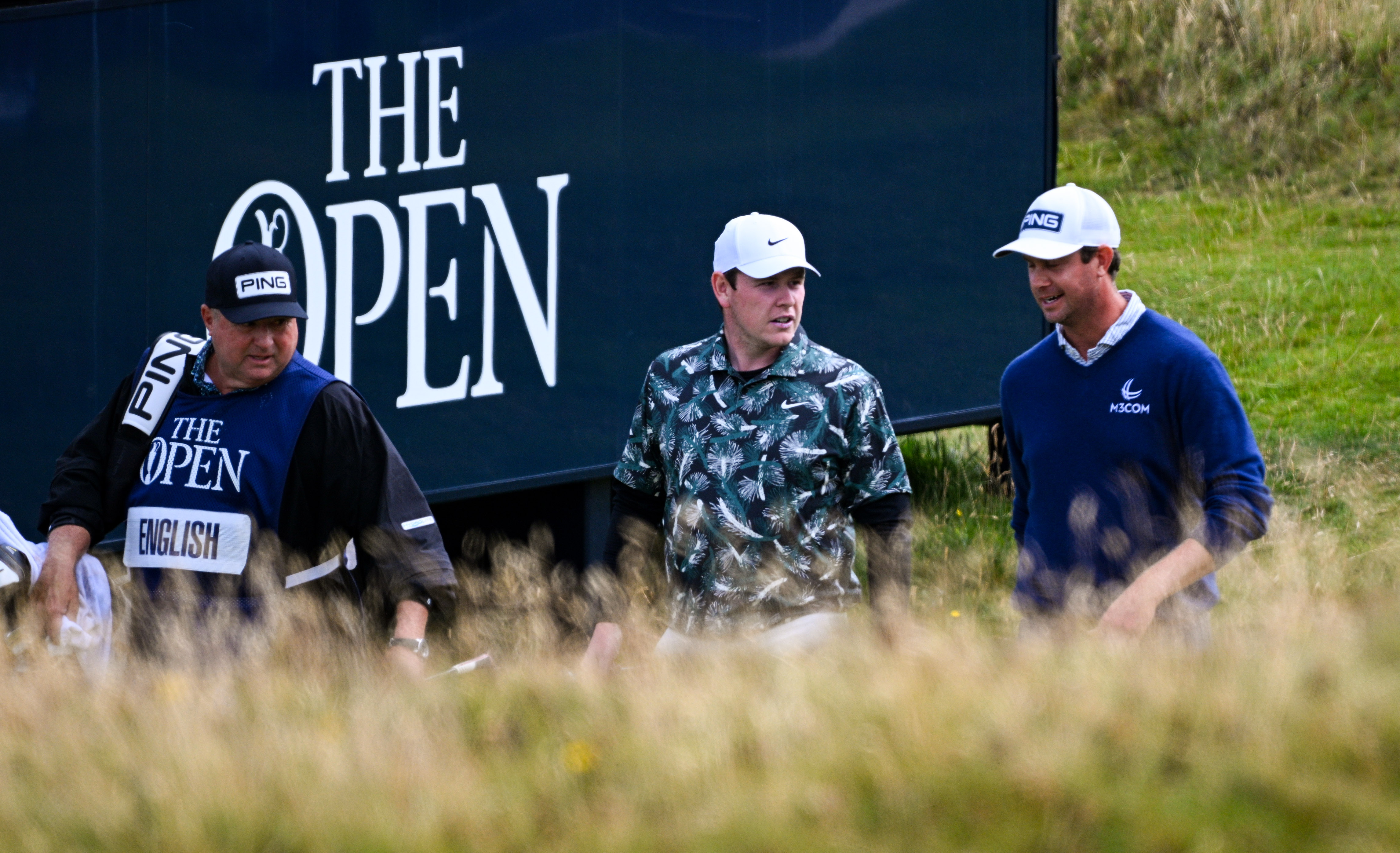 (L to R) Eric Larson, Robert MacIntyre and Harris English at The 152nd Open Championship at Royal Troon in 2024