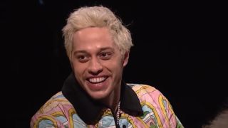 Pete Davidson laughs on The Tonight Show with Jimmy Fallon.
