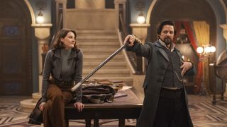 Lysa (Olivia Morris) watches Vikram (Callum McGowan) wave his sword in The Librarians: The Next Chapter season 2