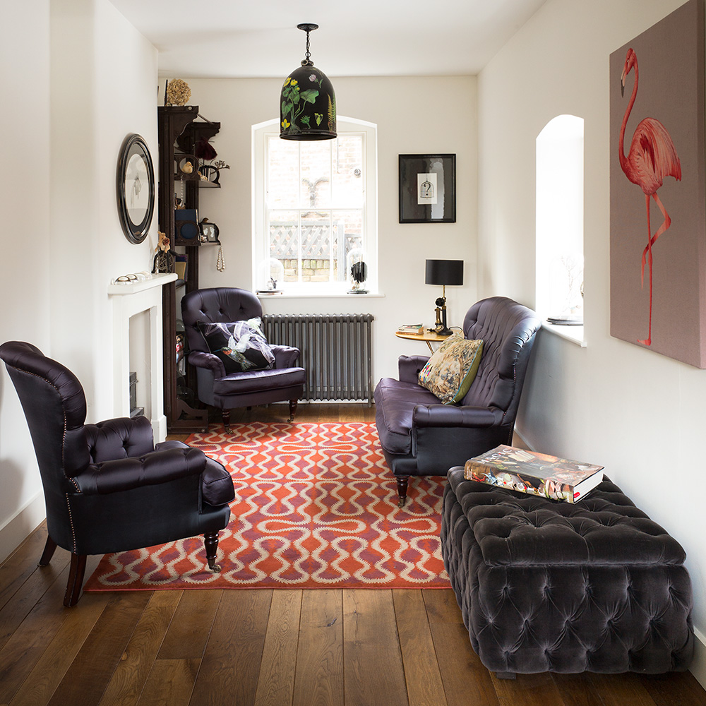 living room with armchair and table lamp