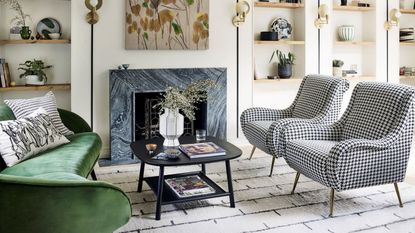 Living room with black and white chairs and green sofa