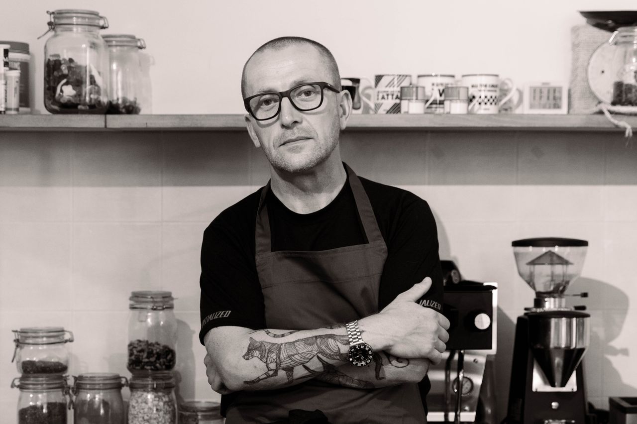 Alan Murchison with his arms folded in a kitchen