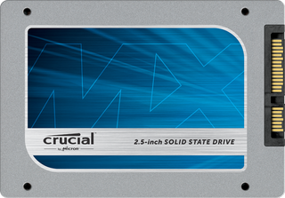 A close up of a grey SSD with branding from the hardware company Crucial