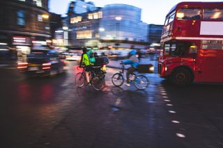 Image of cyclists, buses and cars in London's busy Trafalgar Square where 2022 Highway Code changes will be in force this year