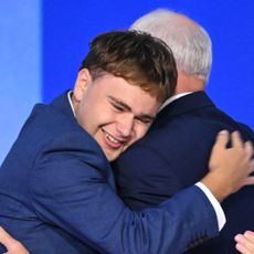 Minnesota Governor and Democratic vice presidential candidate Tim Walz is embraced by his son Gus. 