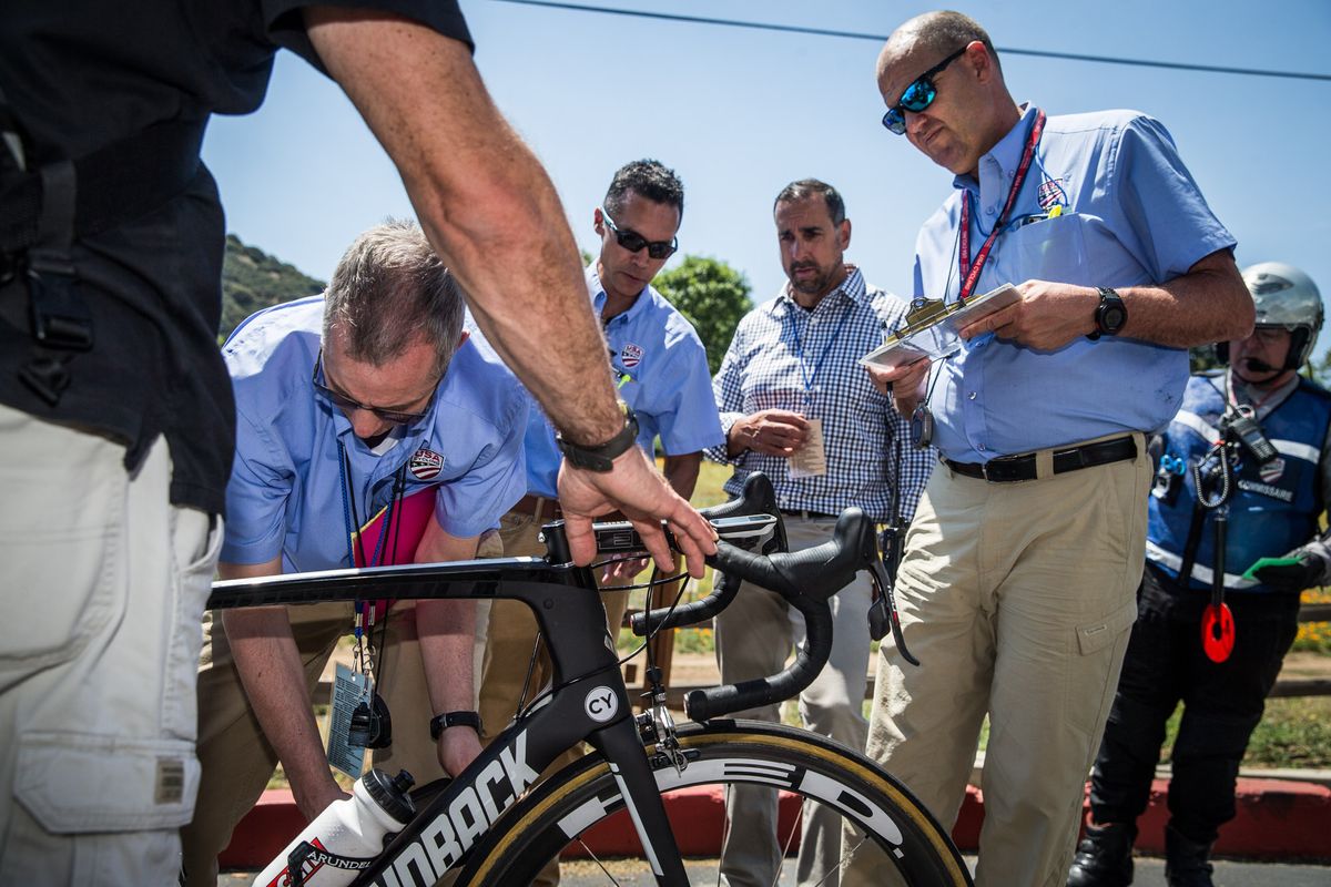 Officials use a special iPad and app to test for motors in bikes