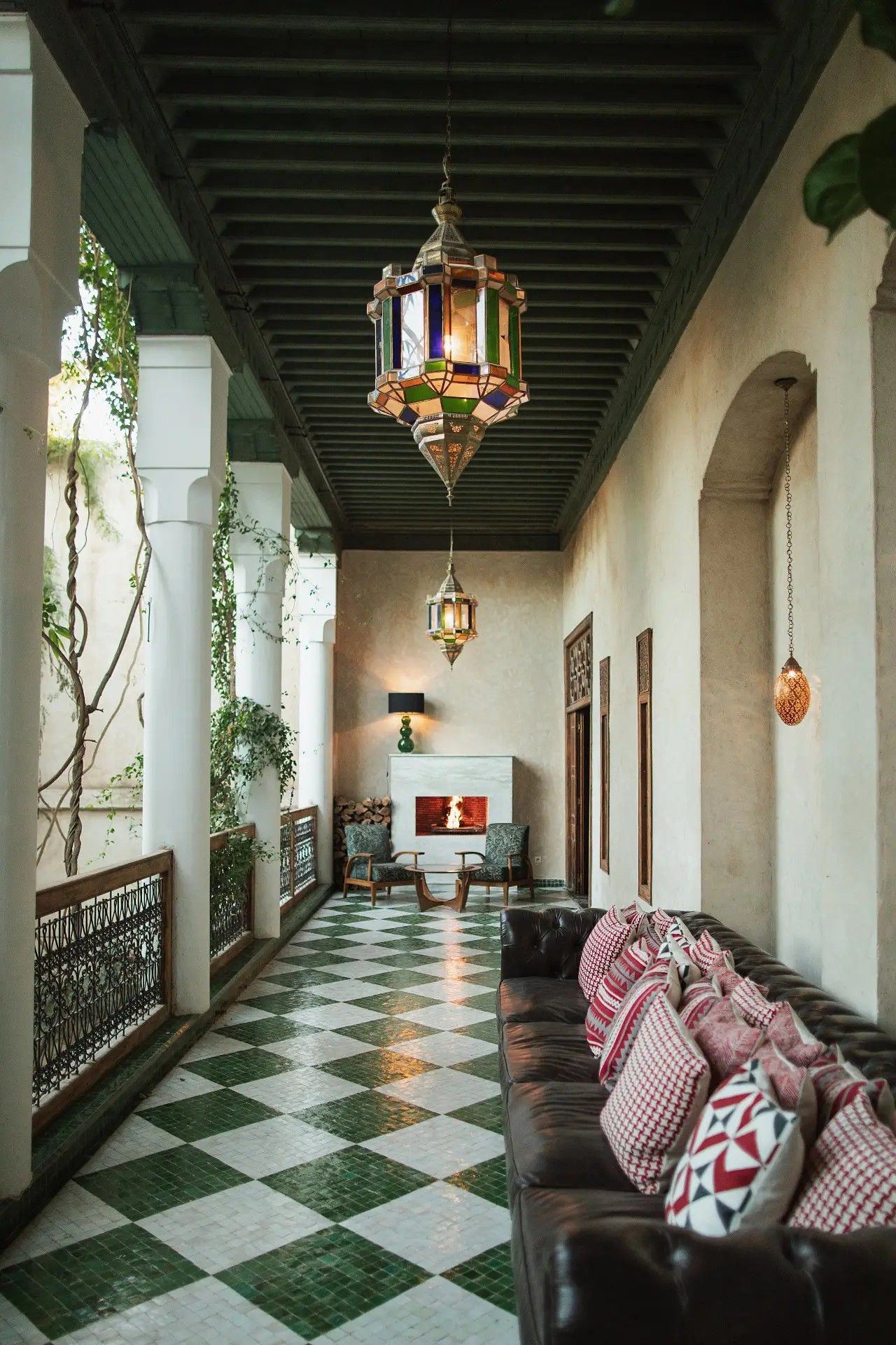 A charming riad has been restored and now boasts furnishings that blend seamlessly with its green, cream, and terracotta color palette while adding much more vibrant hues into its scheme.