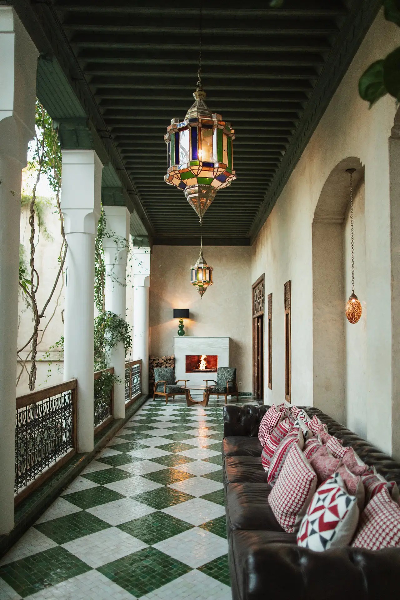 A charming riad has been restored and now boasts furnishings that blend seamlessly with its green, cream, and terracotta color palette while adding much more vibrant hues into its scheme.