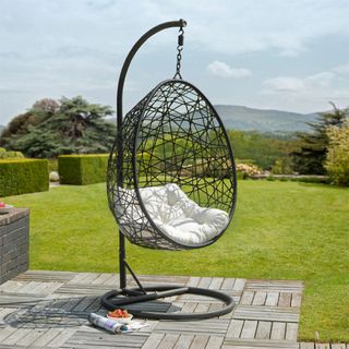 garden recliner swing in open lawn area