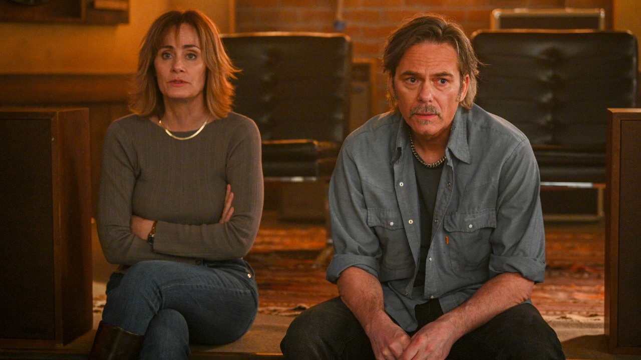 From left to right: Diane Farr as Sharon looking sad and Billy Burke as Vince looking sad in Fire Country.