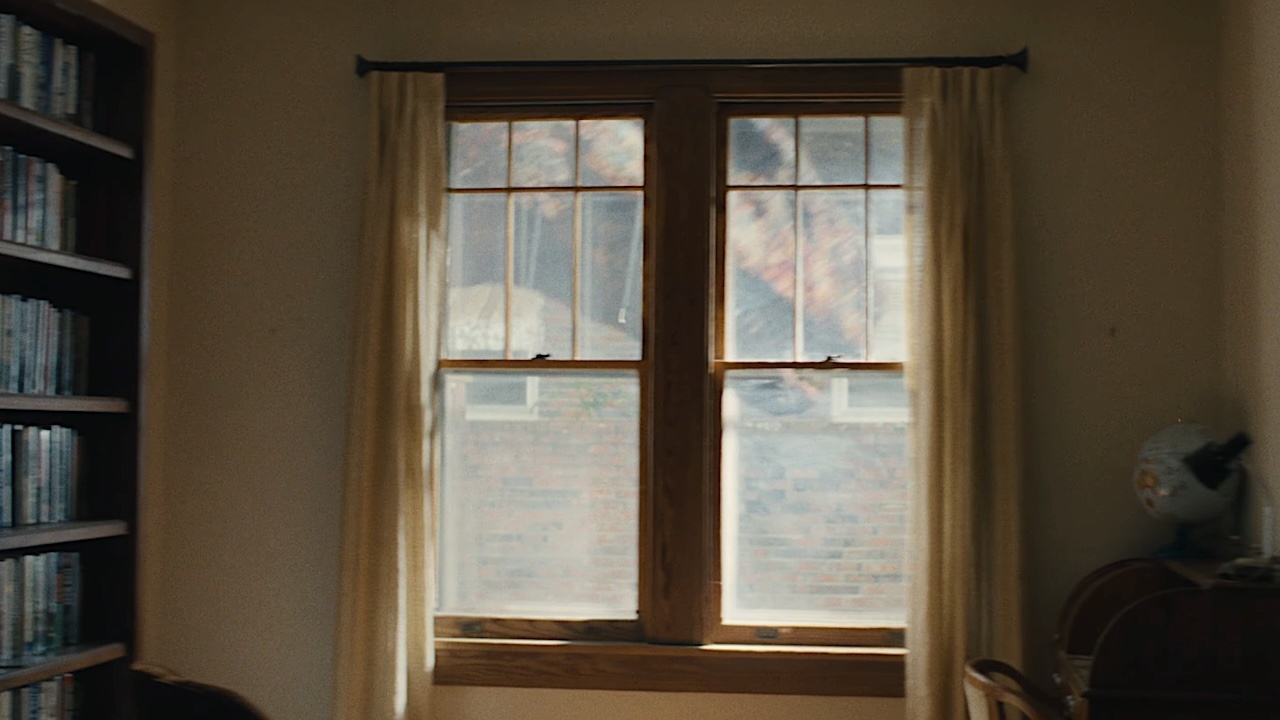 dinosaurs outside a window in the end of oak street