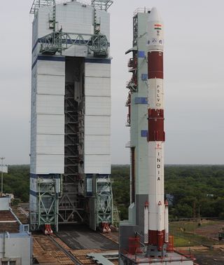 The Polar Satellite Launch Vehicle launching on the country's 100th space mission rolls out to its launch pad at the Satish Dhawan Space Center.